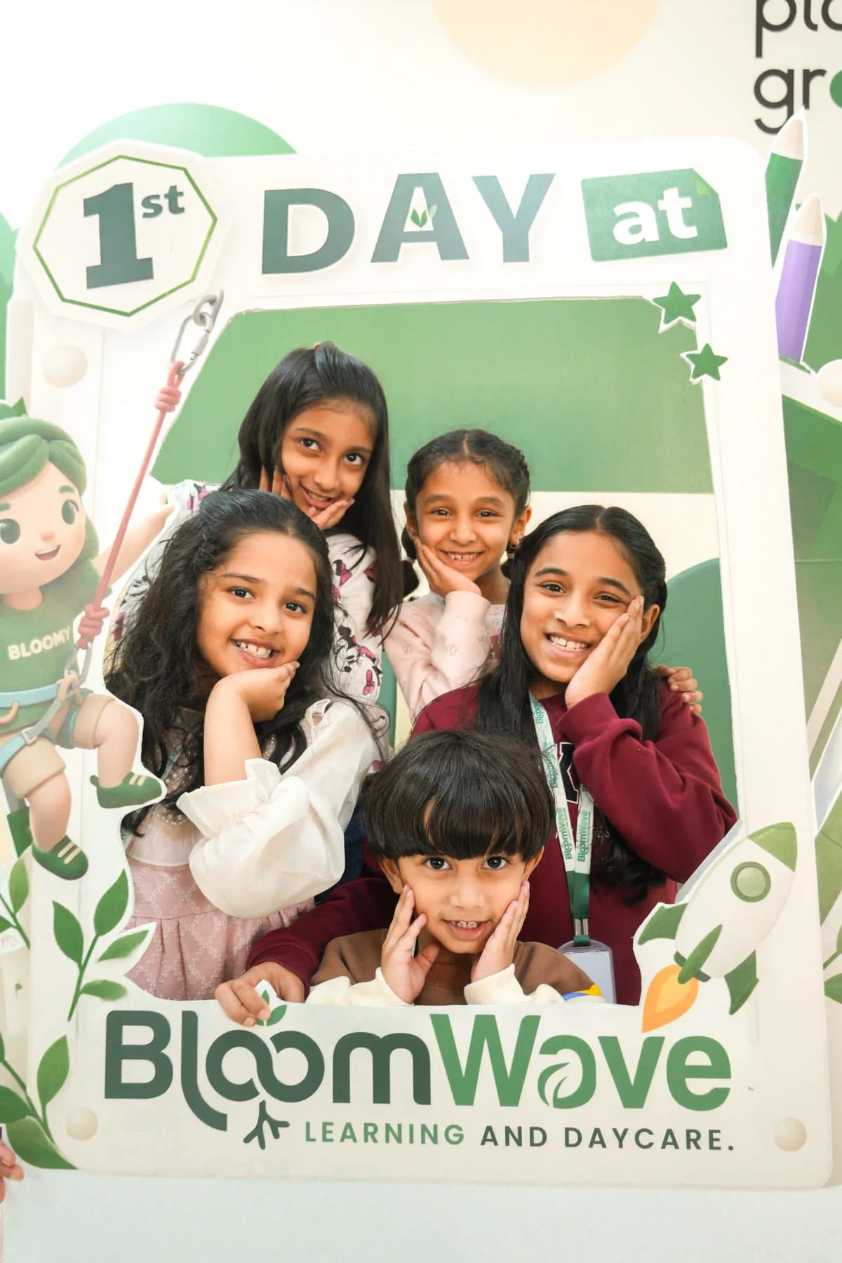 Children posing together for a first-day photo at BloomWave Learning and Daycare